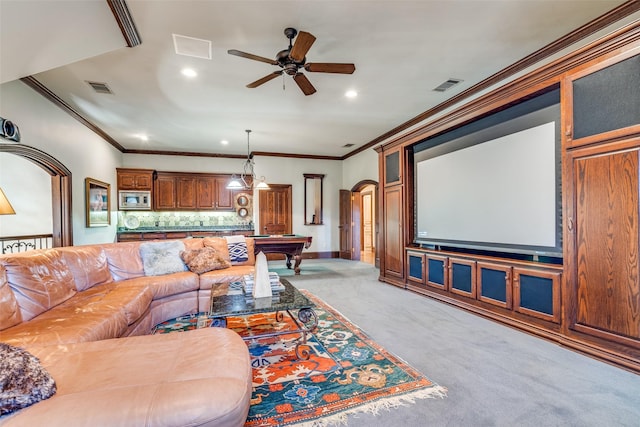 carpeted cinema with pool table, ornamental molding, and ceiling fan