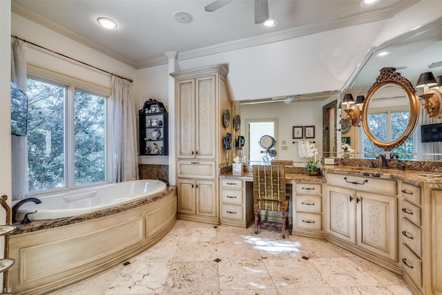 bathroom featuring ceiling fan, a washtub, crown molding, and vanity