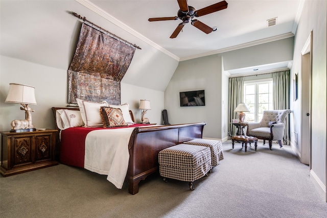 carpeted bedroom with ceiling fan, vaulted ceiling, and crown molding