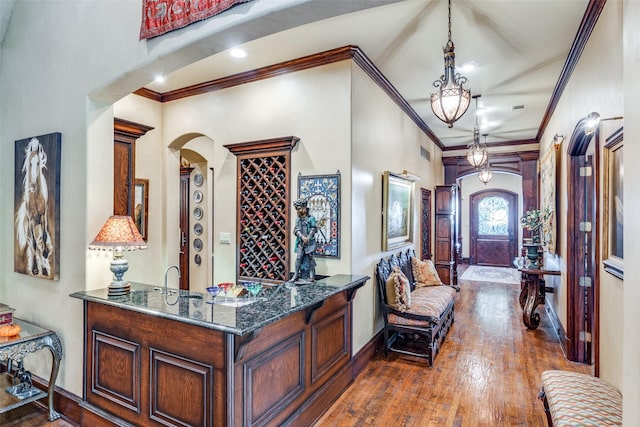 interior space with dark wood-type flooring and crown molding