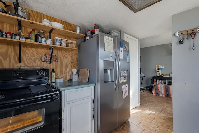 kitchen featuring black electric range, stainless steel fridge with ice dispenser, a textured ceiling, white cabinets, and light tile patterned flooring