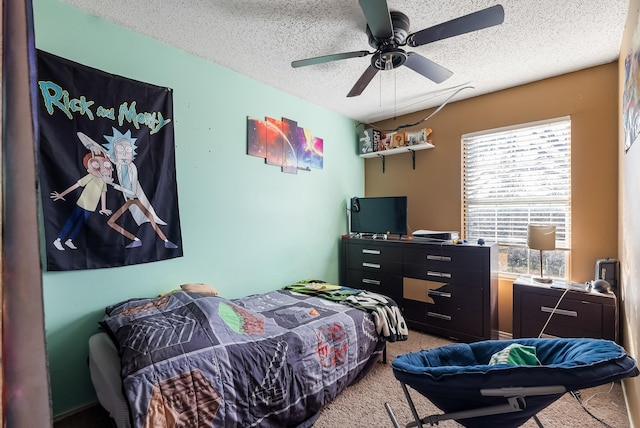 carpeted bedroom featuring a textured ceiling and ceiling fan