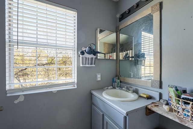 bathroom with a healthy amount of sunlight and vanity