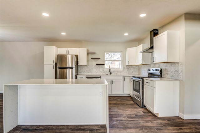 kitchen with dark wood-type flooring, a kitchen island, white cabinetry, appliances with stainless steel finishes, and sink