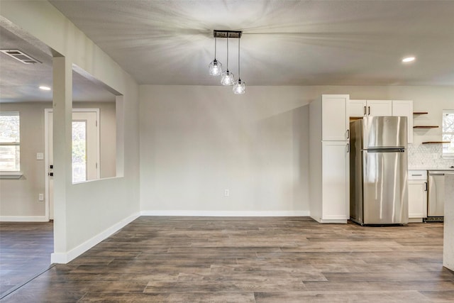 unfurnished dining area with light hardwood / wood-style flooring