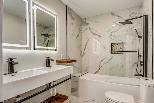 bathroom with tiled shower / bath combo and toilet