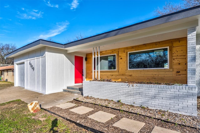 view of exterior entry featuring a garage