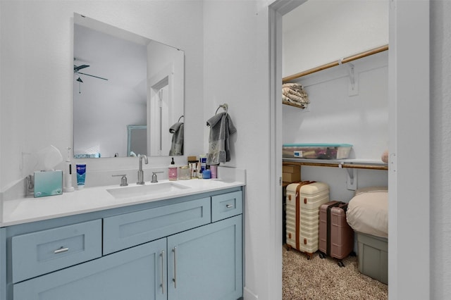 bathroom featuring vanity and ceiling fan