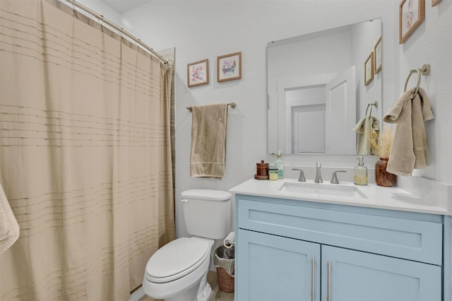 bathroom with vanity, a shower with shower curtain, and toilet