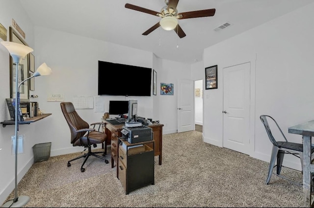 office space with ceiling fan and carpet