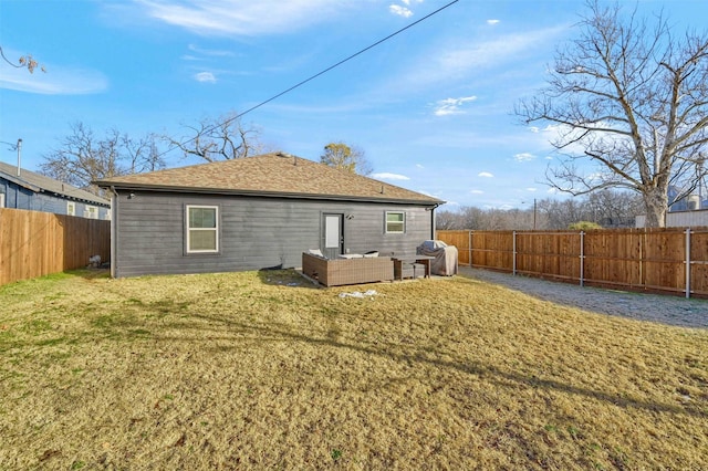 back of house with an outdoor hangout area and a lawn