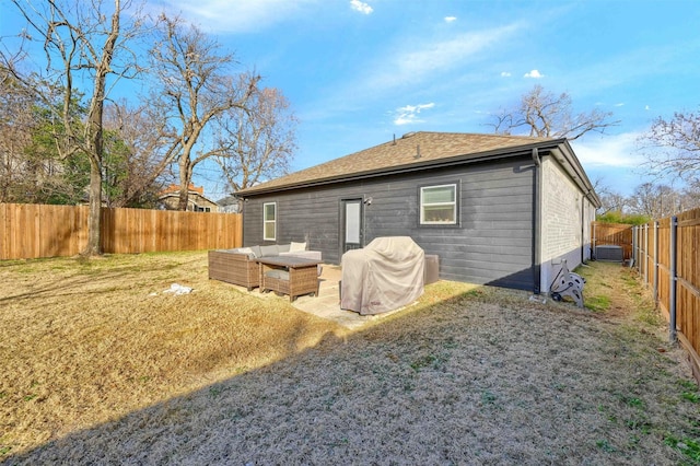 back of property featuring a patio, a yard, and an outdoor hangout area