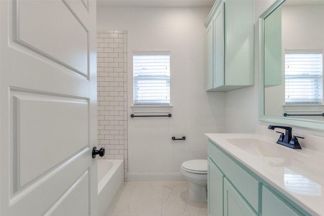 full bathroom with tiled shower / bath combo, vanity, and toilet