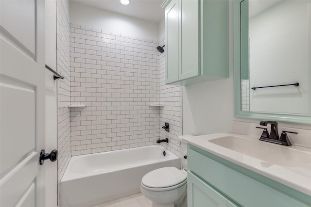 full bathroom featuring vanity, tiled shower / bath combo, and toilet