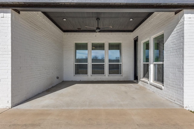 view of patio featuring ceiling fan