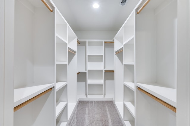 walk in closet featuring carpet