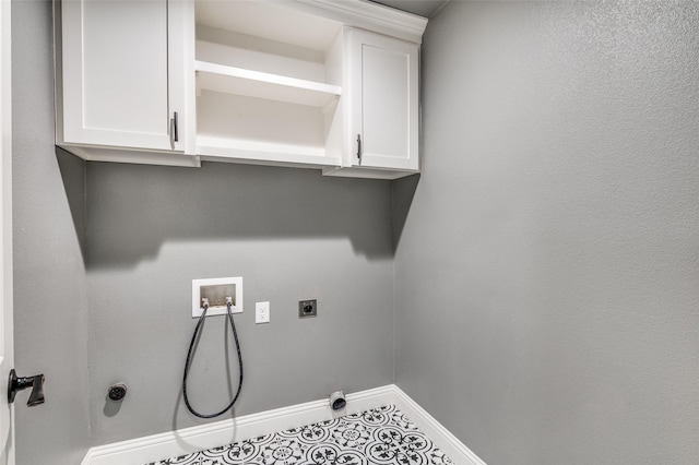 laundry area with tile patterned flooring, hookup for a washing machine, and hookup for an electric dryer