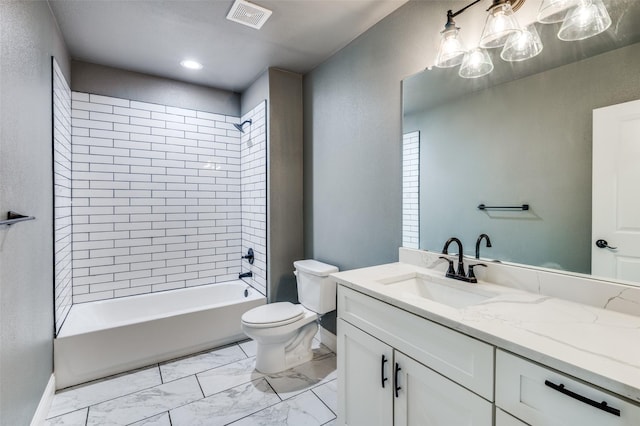 full bathroom featuring toilet, tiled shower / bath combo, and vanity