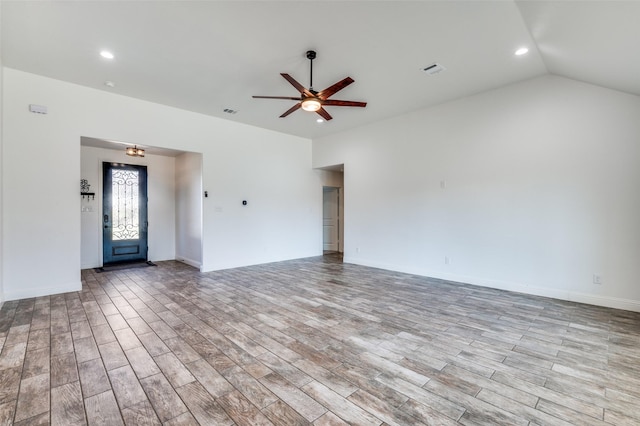 spare room with lofted ceiling and ceiling fan