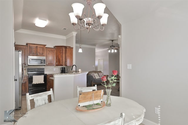 dining room with crown molding and ceiling fan with notable chandelier