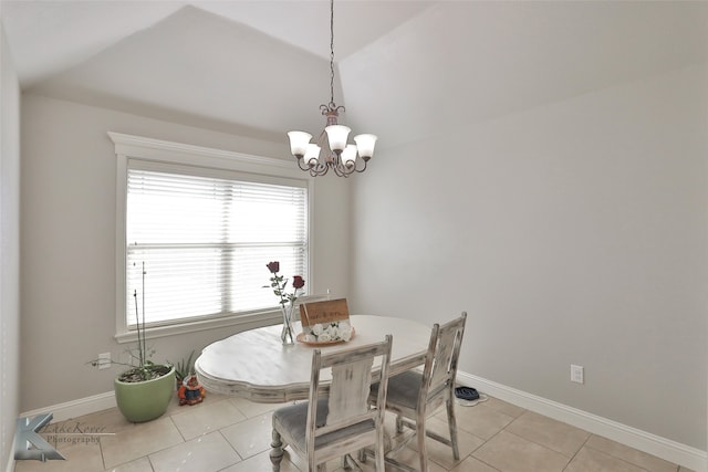 tiled dining area with a chandelier