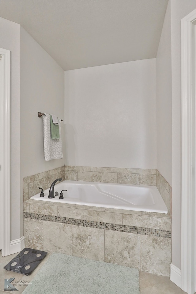 bathroom featuring tiled bath