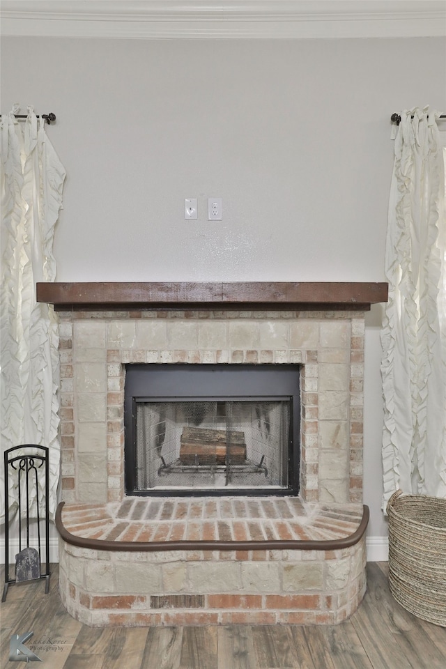 interior details with ornamental molding and wood-type flooring