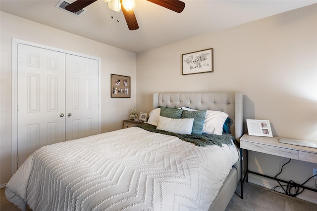 carpeted bedroom with a closet and ceiling fan