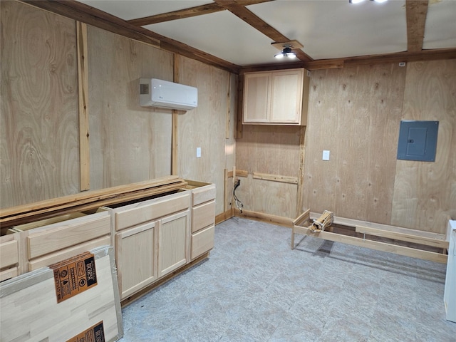 interior space with light colored carpet, light brown cabinets, electric panel, and a wall mounted AC