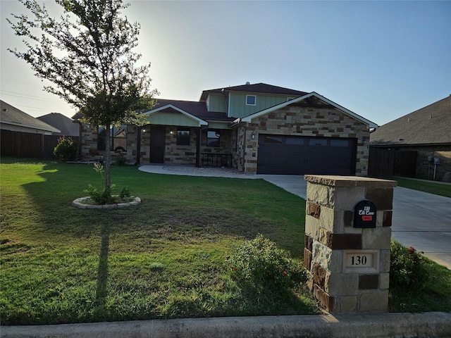 craftsman inspired home with a front yard and a garage