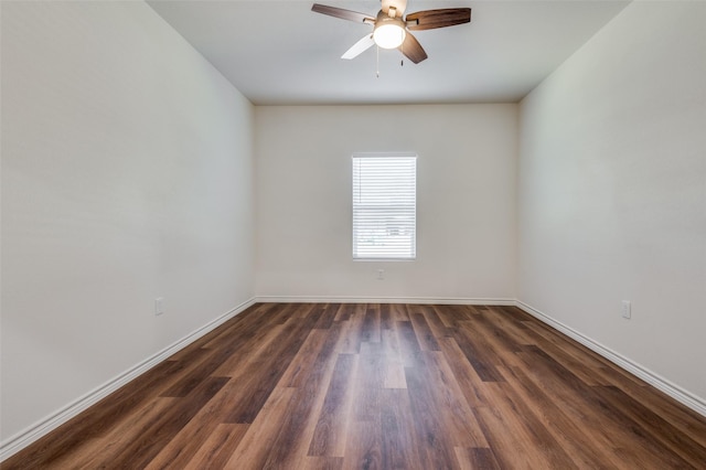 empty room featuring dark hardwood / wood-style floors and ceiling fan