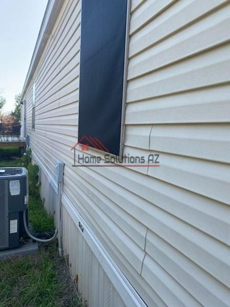 view of side of property featuring central AC unit