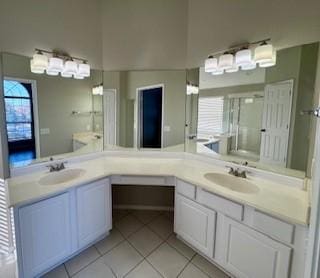 bathroom with tile patterned floors and vanity