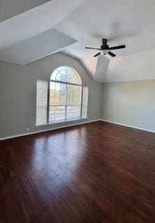 unfurnished room with lofted ceiling, dark wood-type flooring, and ceiling fan