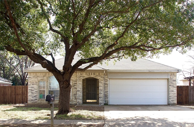 ranch-style house featuring a garage