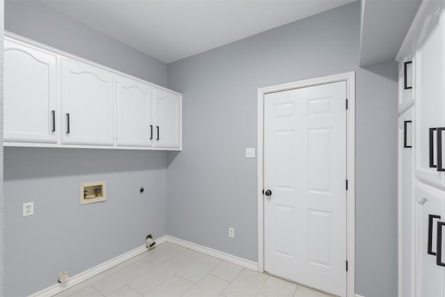 laundry area featuring hookup for a washing machine, cabinets, hookup for an electric dryer, and gas dryer hookup