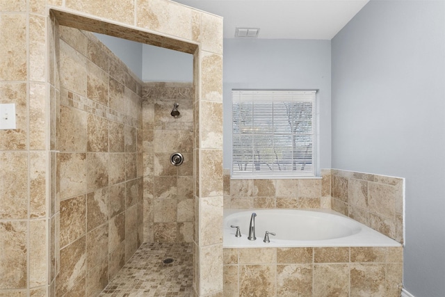 bathroom featuring separate shower and tub