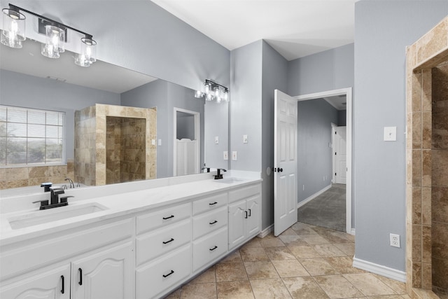 bathroom featuring vanity, tile patterned floors, and walk in shower