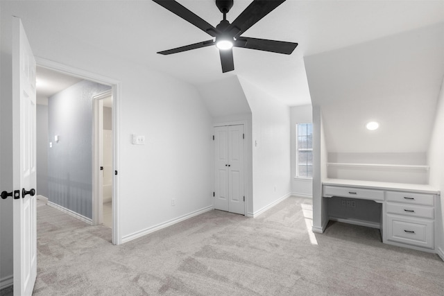 additional living space with lofted ceiling, ceiling fan, and light carpet