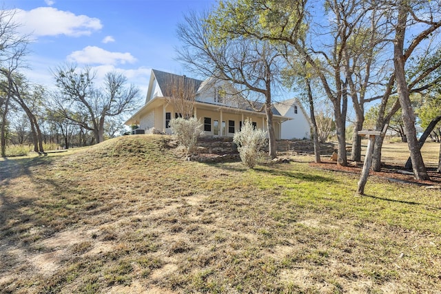 view of home's exterior with a lawn