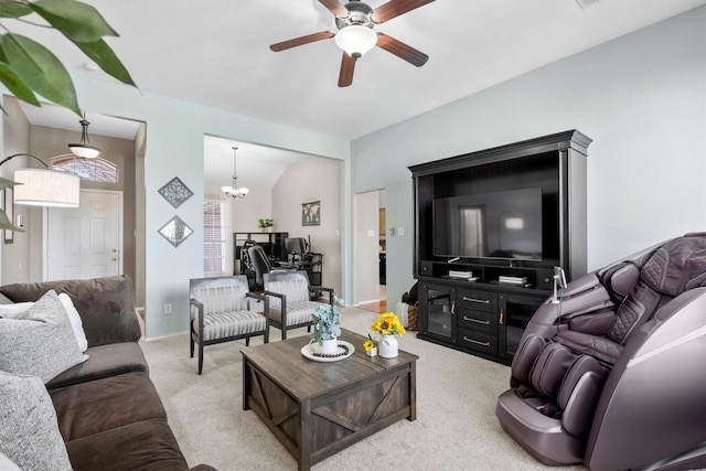 carpeted living room featuring lofted ceiling and ceiling fan with notable chandelier