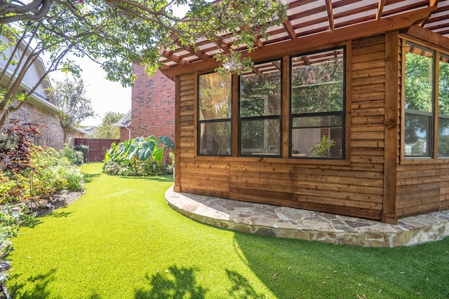 view of side of property with a yard