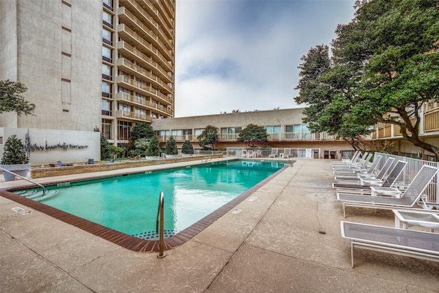 view of swimming pool with a patio area