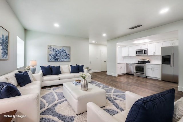 living room with dark wood-type flooring