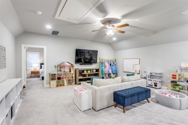 carpeted living room with lofted ceiling and ceiling fan