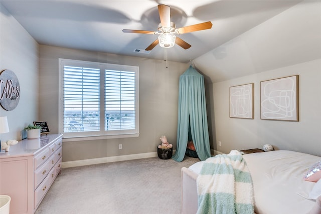 carpeted bedroom with ceiling fan and lofted ceiling