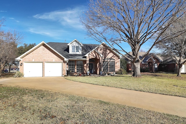 view of front of home featuring a front yard and a garage