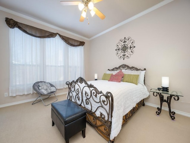 bedroom featuring carpet flooring, ceiling fan, and crown molding