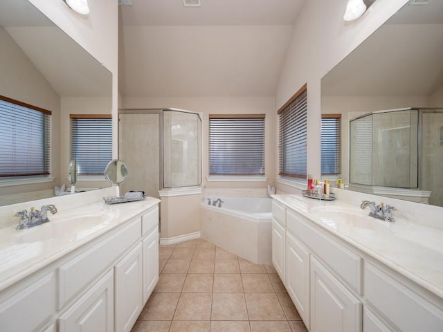 bathroom featuring separate shower and tub, vanity, lofted ceiling, and tile patterned floors