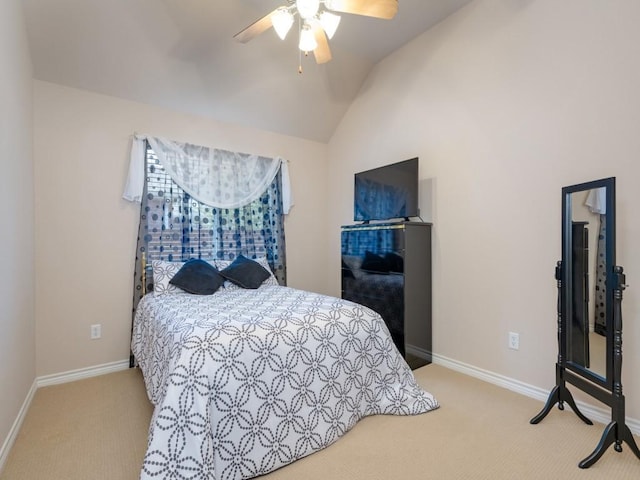 bedroom with ceiling fan, light colored carpet, and lofted ceiling